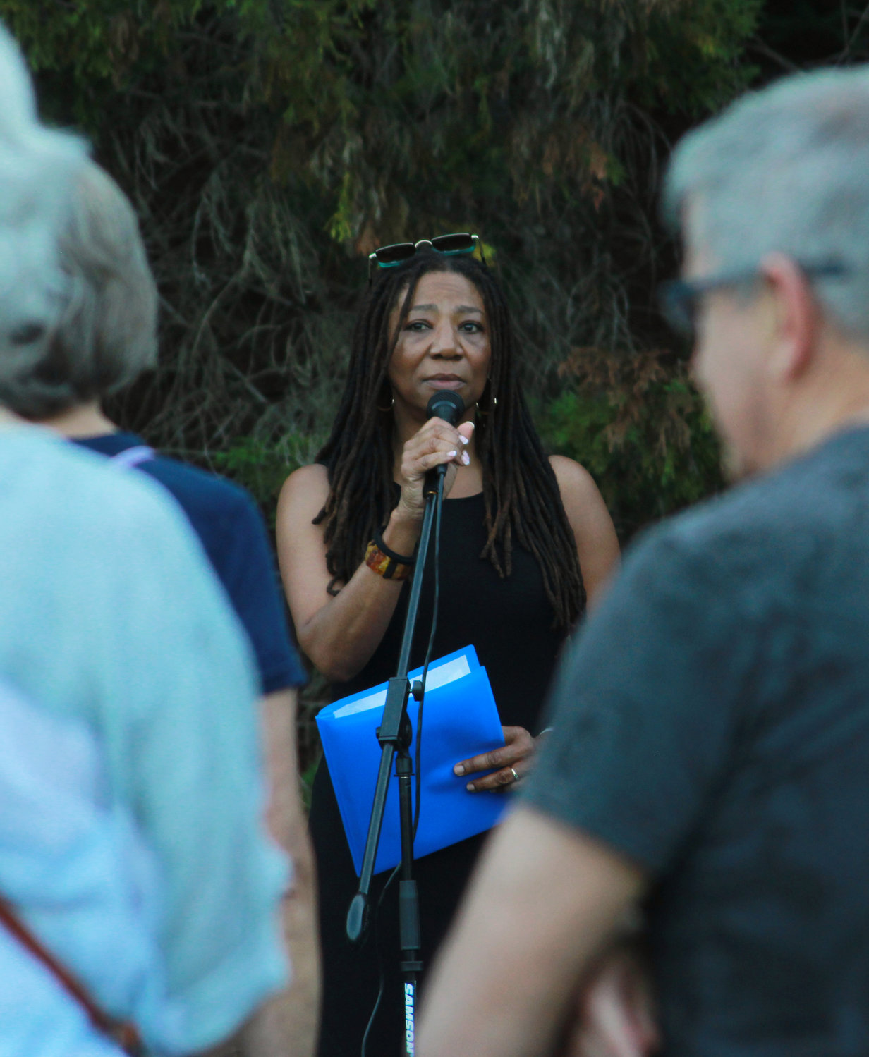 Commisioner Karen Howard addresses the crowd during the Chatham County vigil for recent mass shootings on Sunday, May 29, in Pittsboro. “I am heartbroken to see you all here,” Howard said.